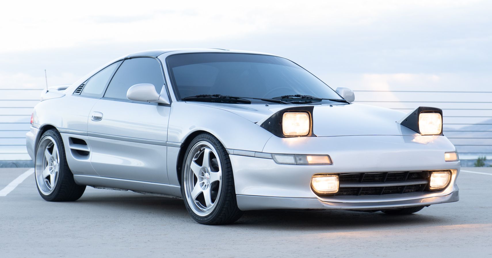 A silver 1991 Toyota MR2 Turbo parked