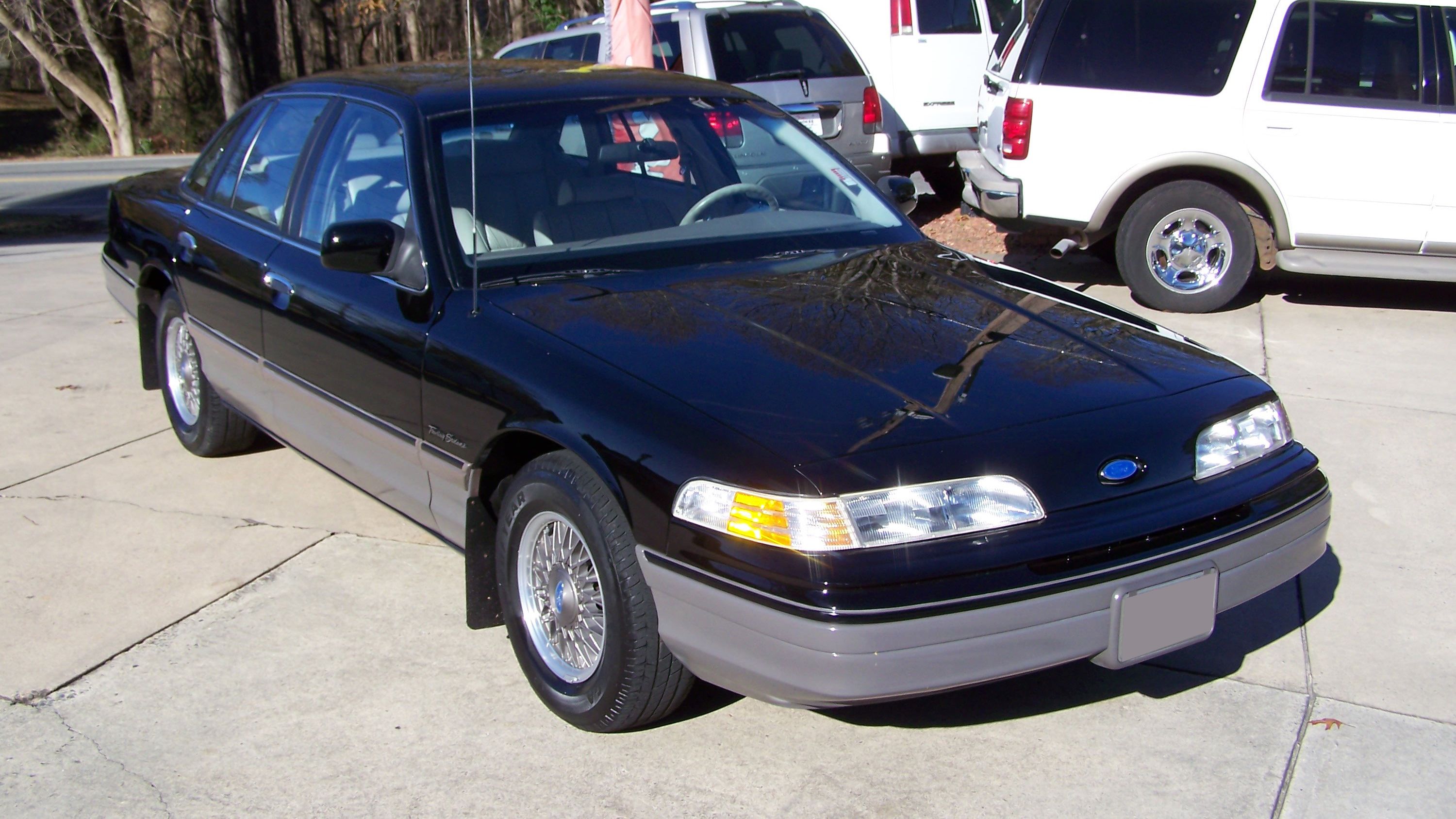 Black 1992 Ford Crown Victoria parked outside