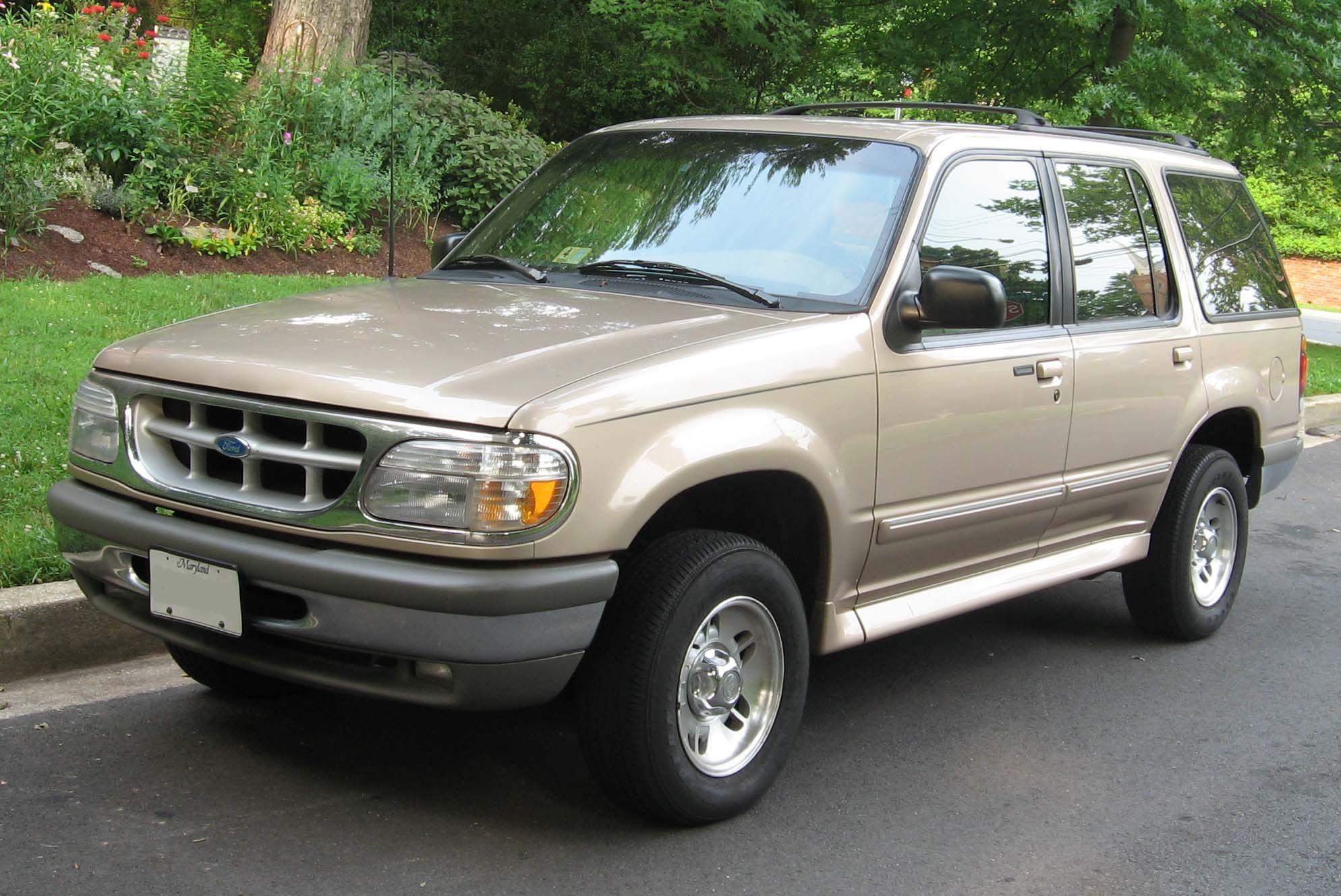 Brown 1995 Ford Explorer parked outside