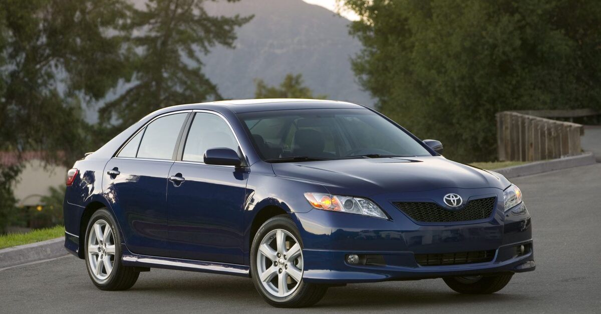 Blue 2007 Toyota Camry on the road