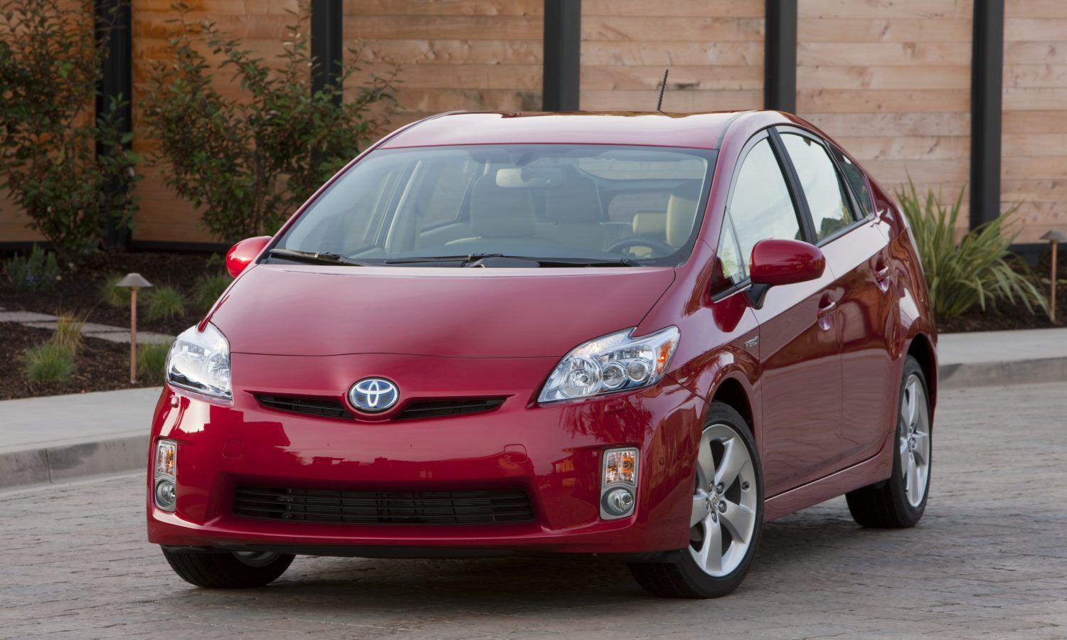 Red 2010 Toyota Prius parked