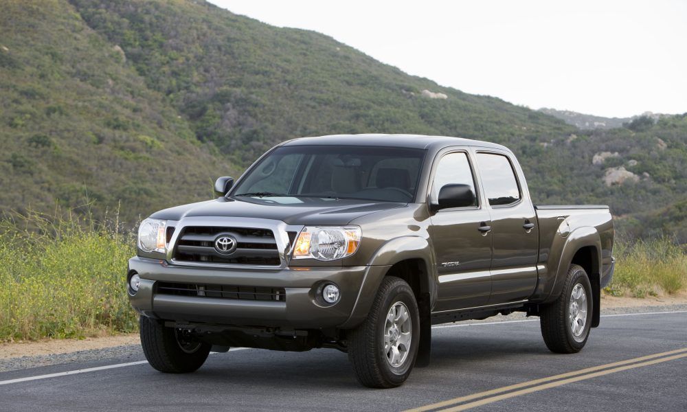 Gray 2010 Toyota Tacoma on the road