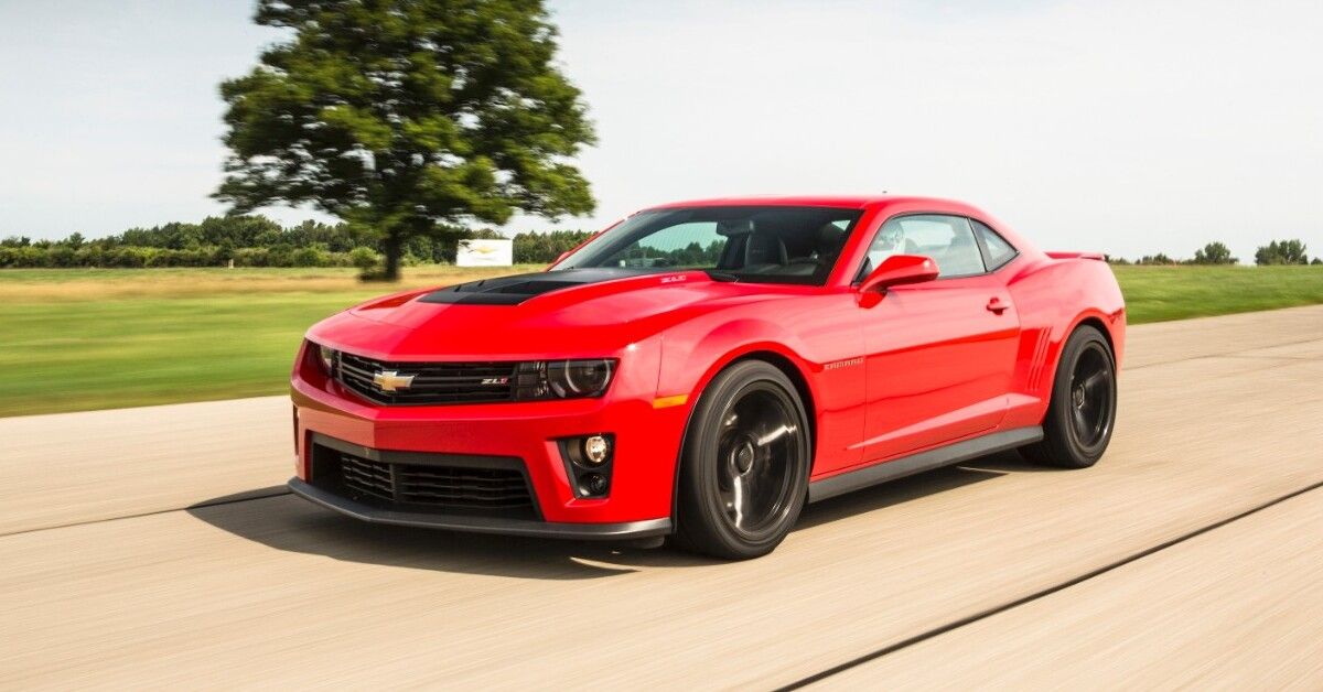 A red 2015 Chevrolet Camaro ZL1 driving