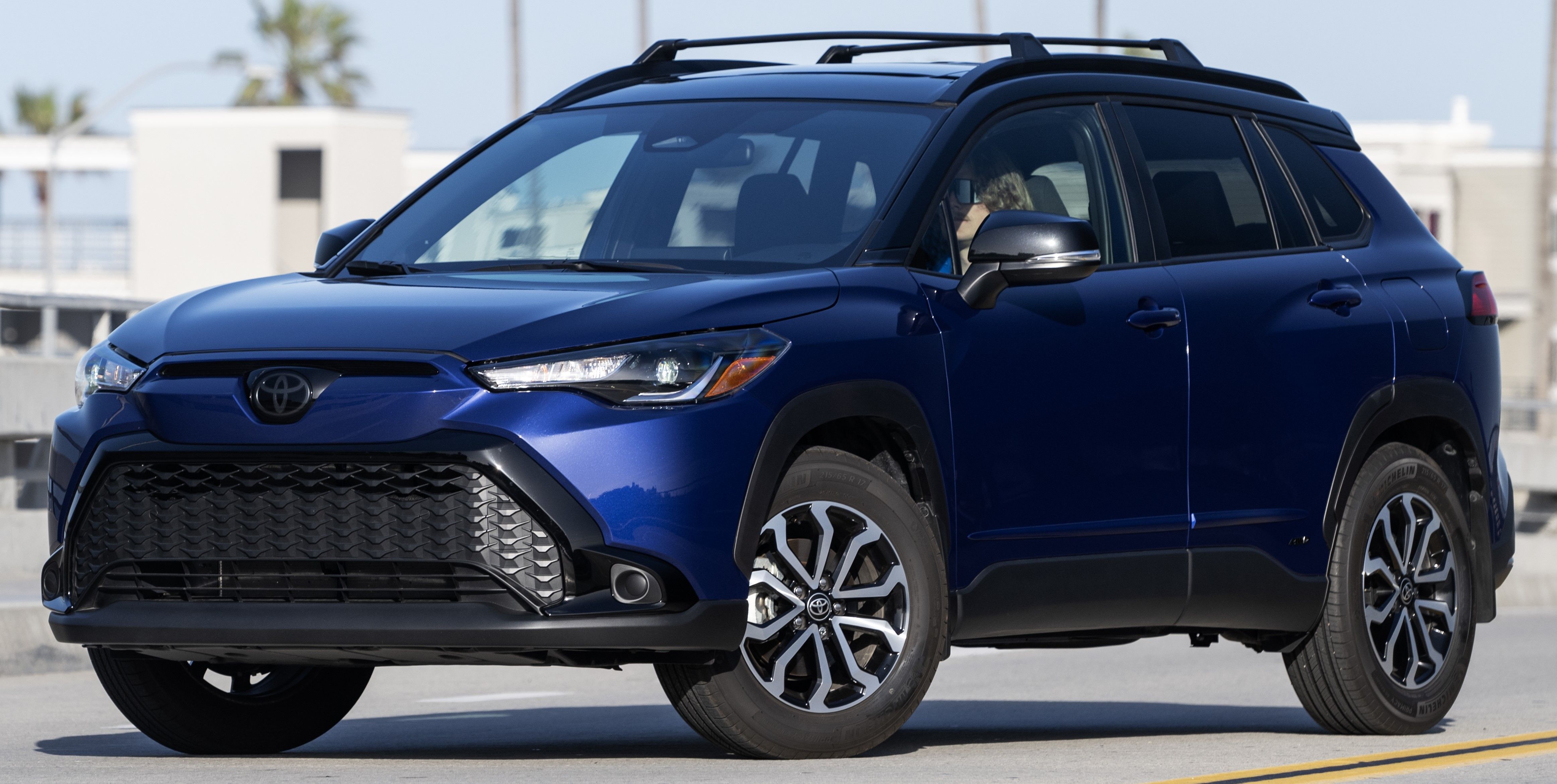 Blue 2023 Toyota Corolla Cross Hybrid parked outdoors