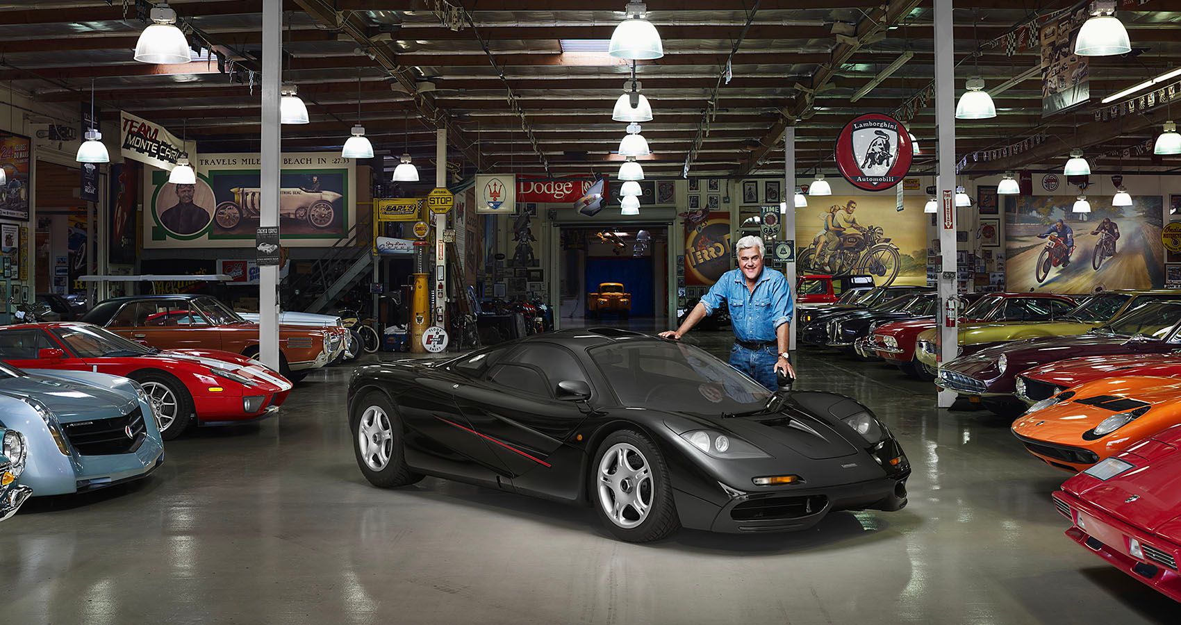 Jay Leno With his McLaren F1 And Car Collection In His Garage
