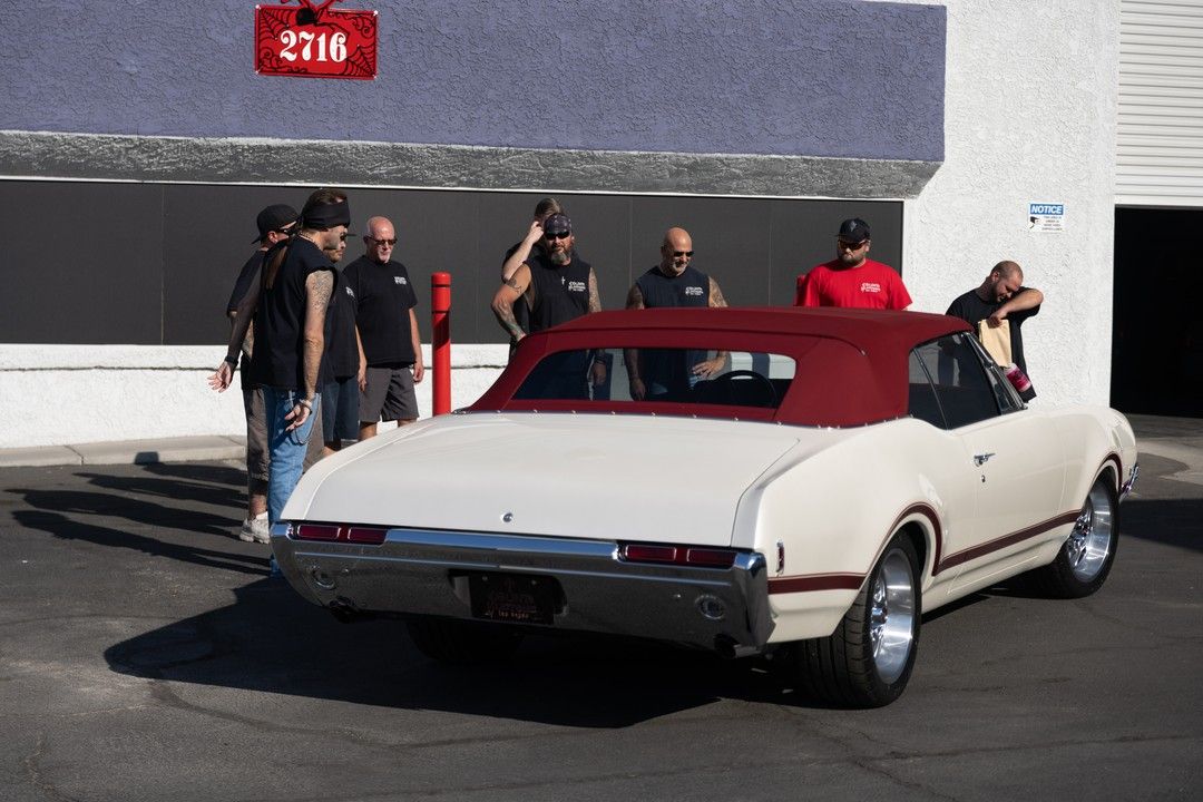 Counting Cars crew admiring a restored vehicle 