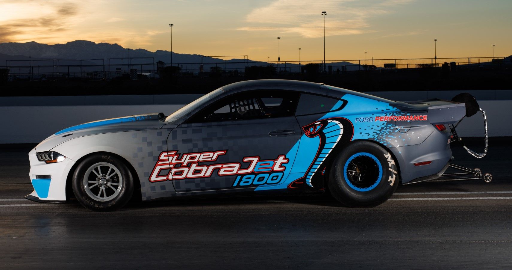 1800-HP Ford Mustang Super Cobra Jet side view on a drag strip