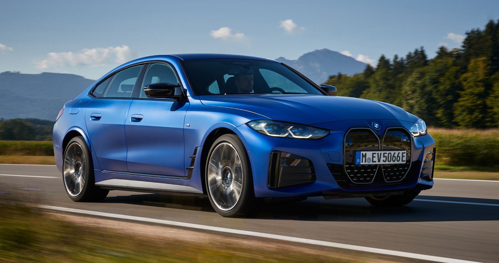 Blue BMW i4 M50 driven on the road