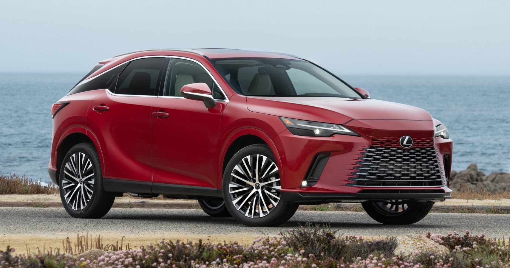 Red 2023 Lexus RX Hybrid parked outdoors