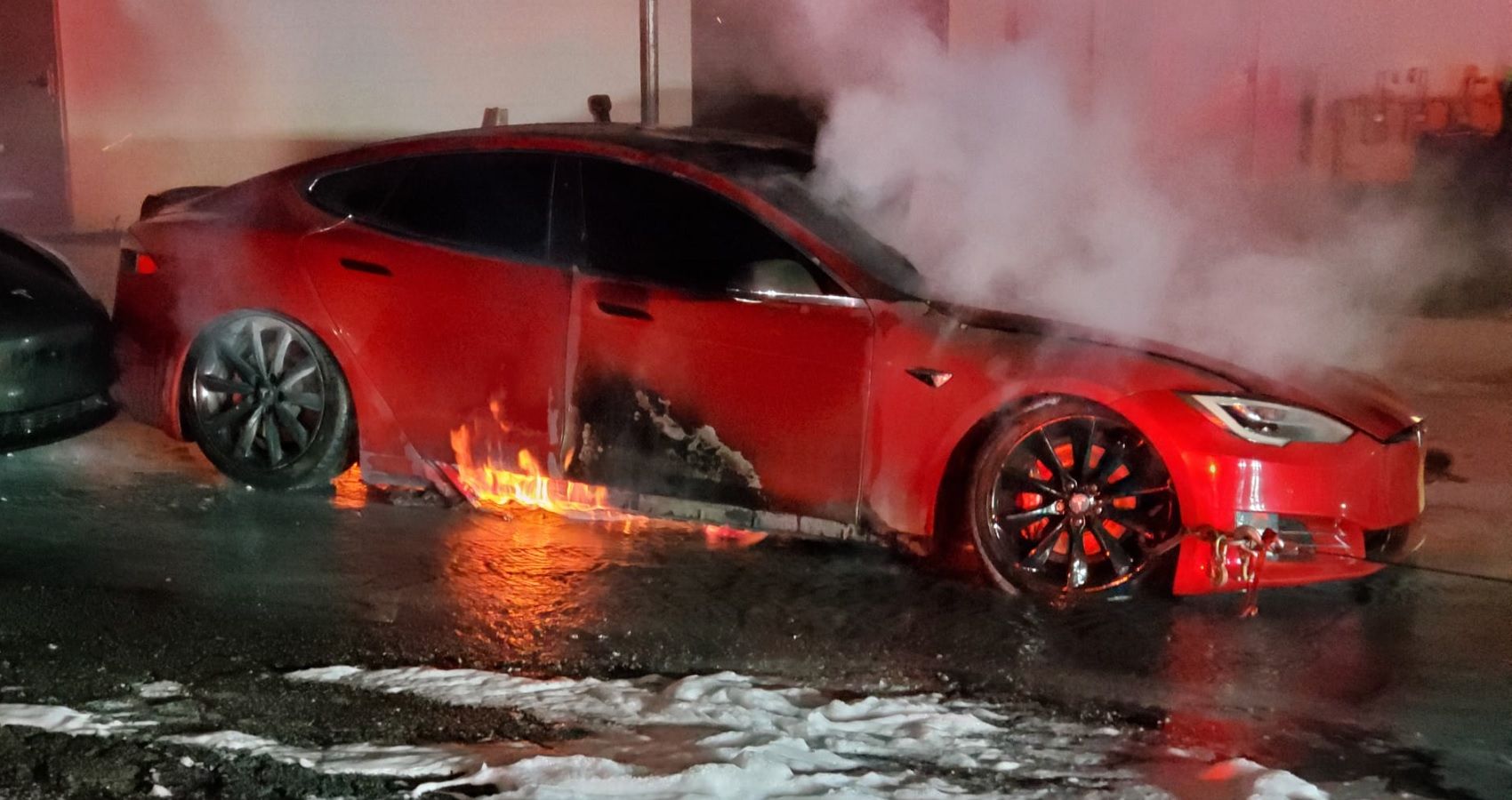 Red Tesla Model S on fire