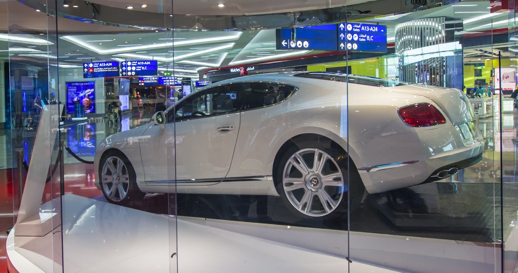 Bentley luxury car inside a shopping center third quarter rear view