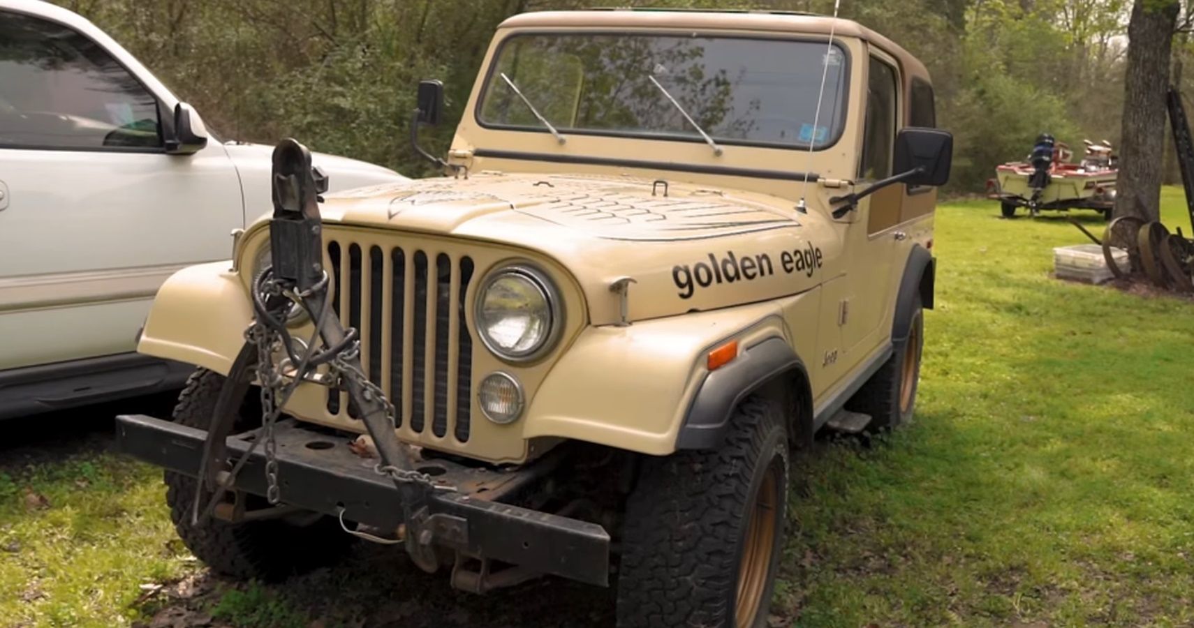 The front view of a tan 1979 Jeep CJ-7 Golden Eagle