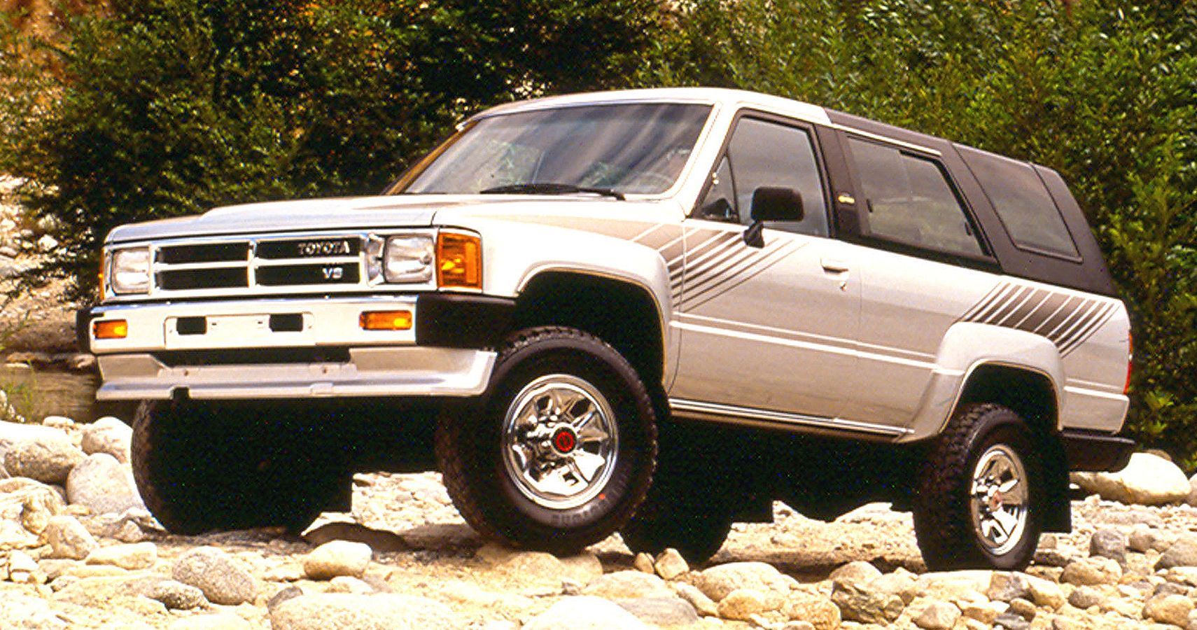 Front angle shot of Silver 1988 Toyota 4Runner on rock trail