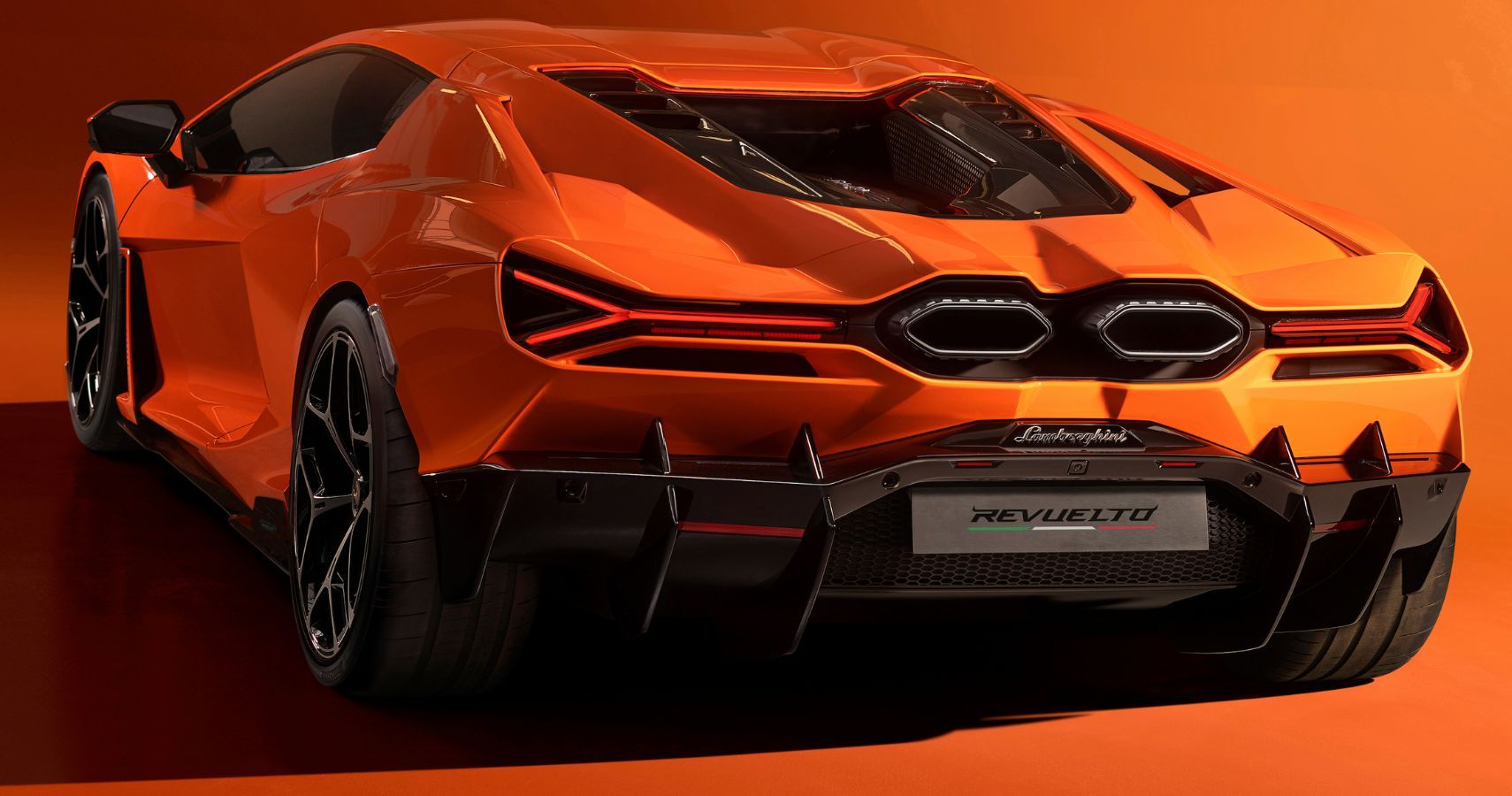 Orange 2024 Lamborghini Revuelto V12 Hybrid Supercar