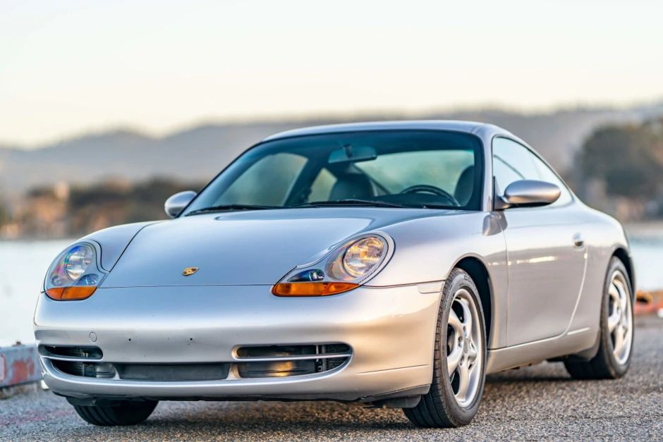 1999 Porsche 911 Carrera silver parked