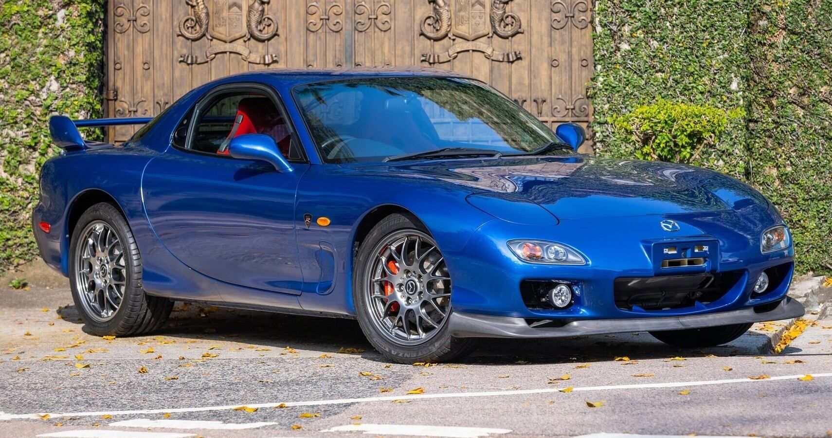 A blue 2002 Mazda RX-7 Spirit-R Type A parked
