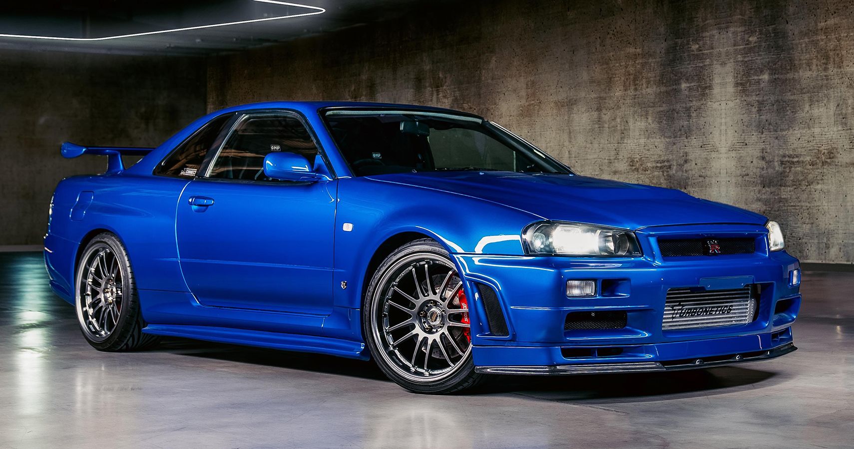 blue 2000 Nissan Skyline R34 GT-R by Kaizo Industries quarter front