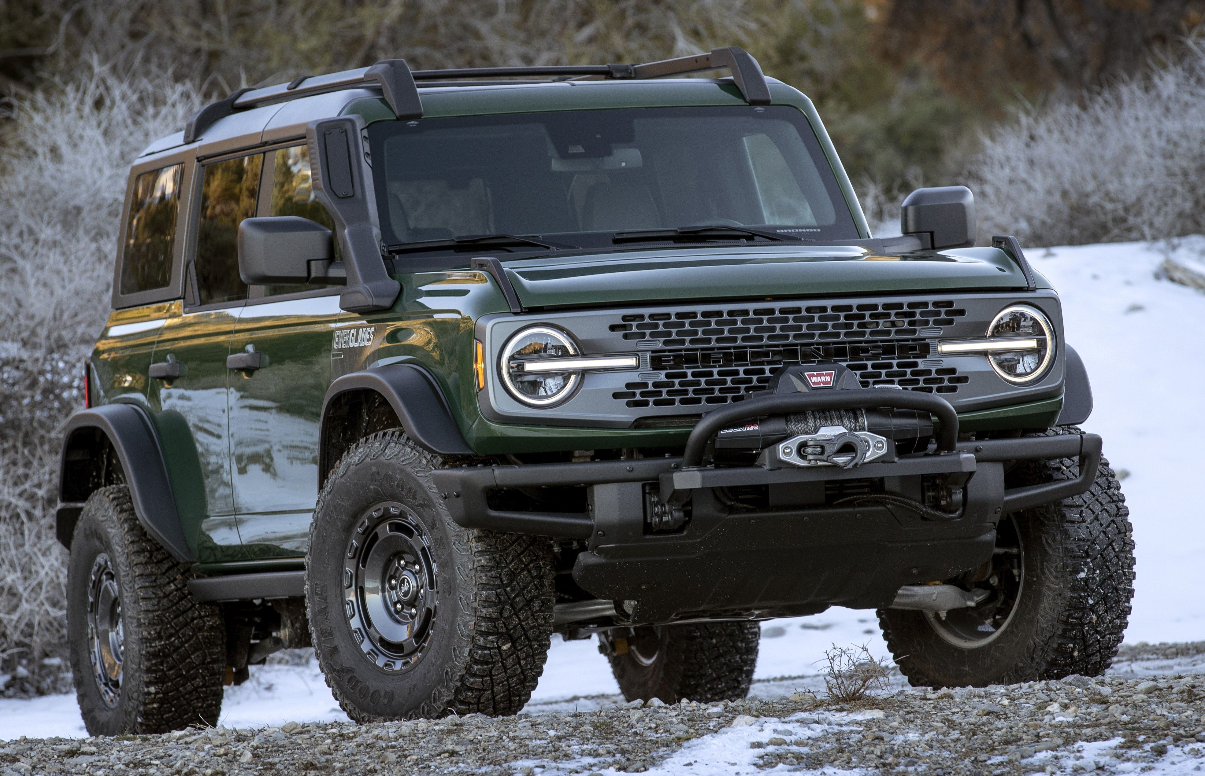 Green 2022 Ford Bronco Everglades parked outdoors in the snow