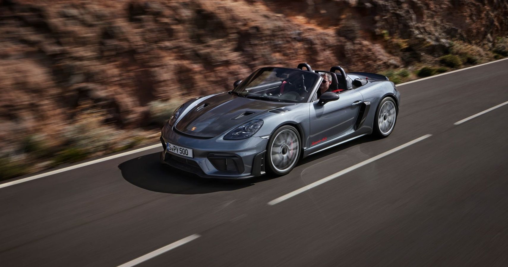 A 2024 Porsche 718 Spyder RS with the top down while driving