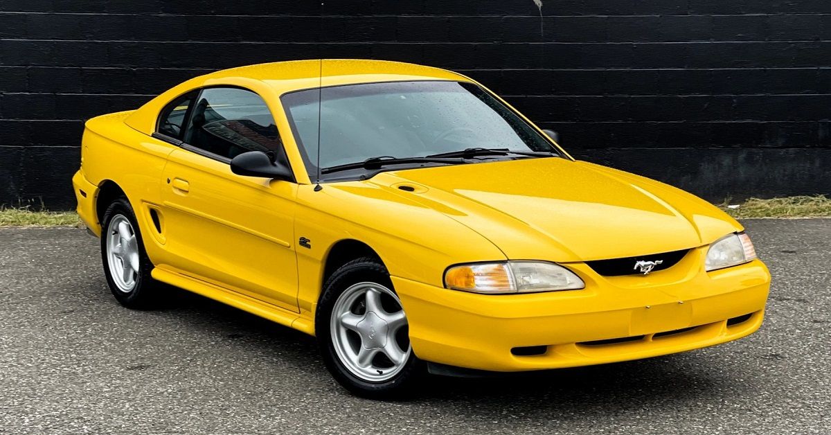 Yellow 1995 Ford Mustang Parked