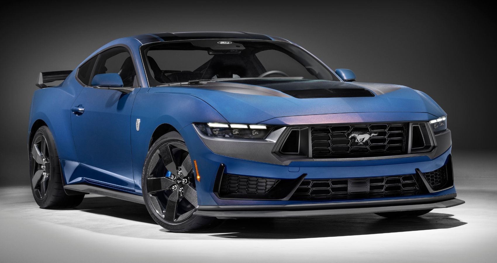Front view of a blue 2024 Ford Mustang