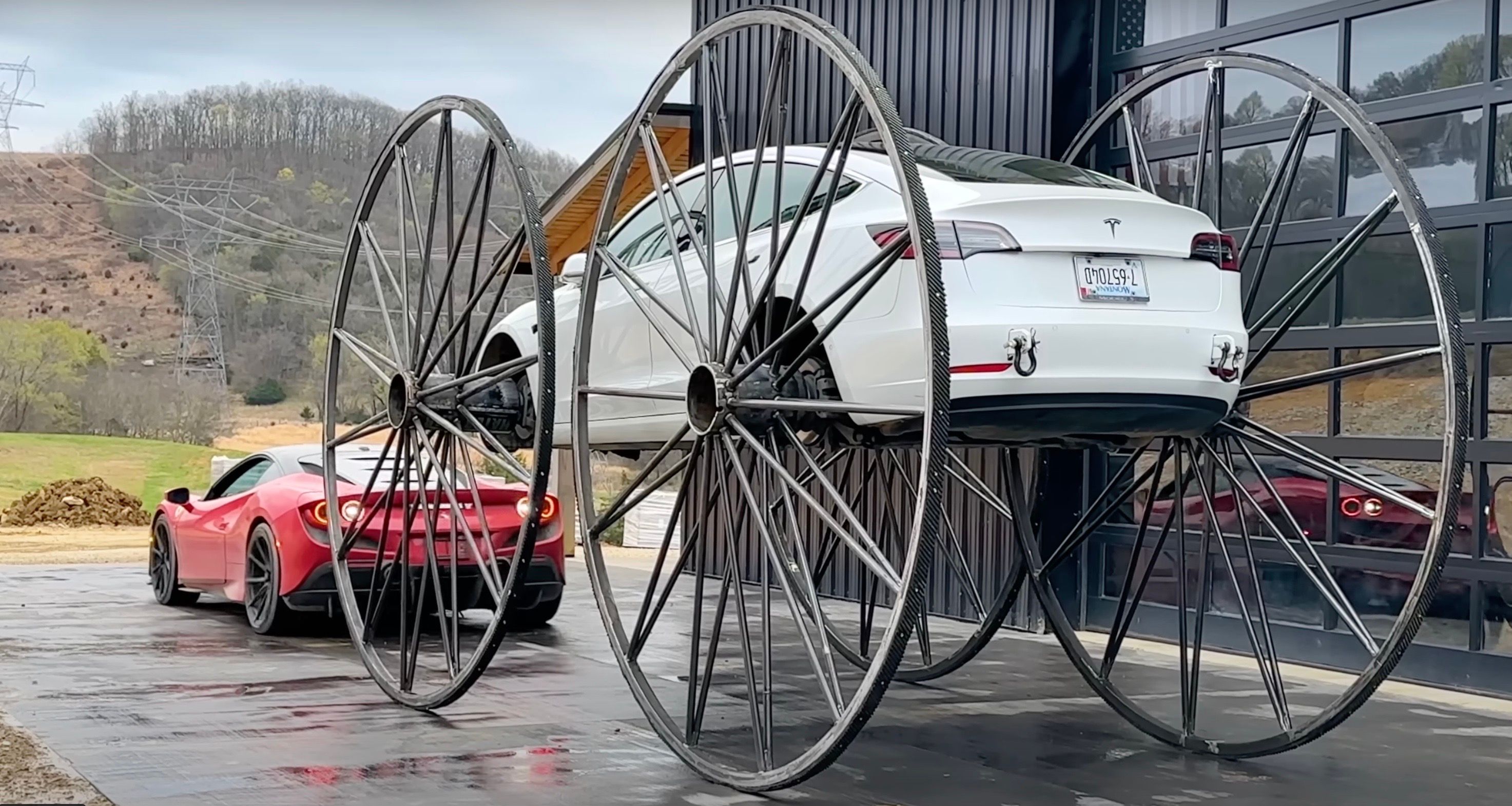 Ferrari under a Tesla