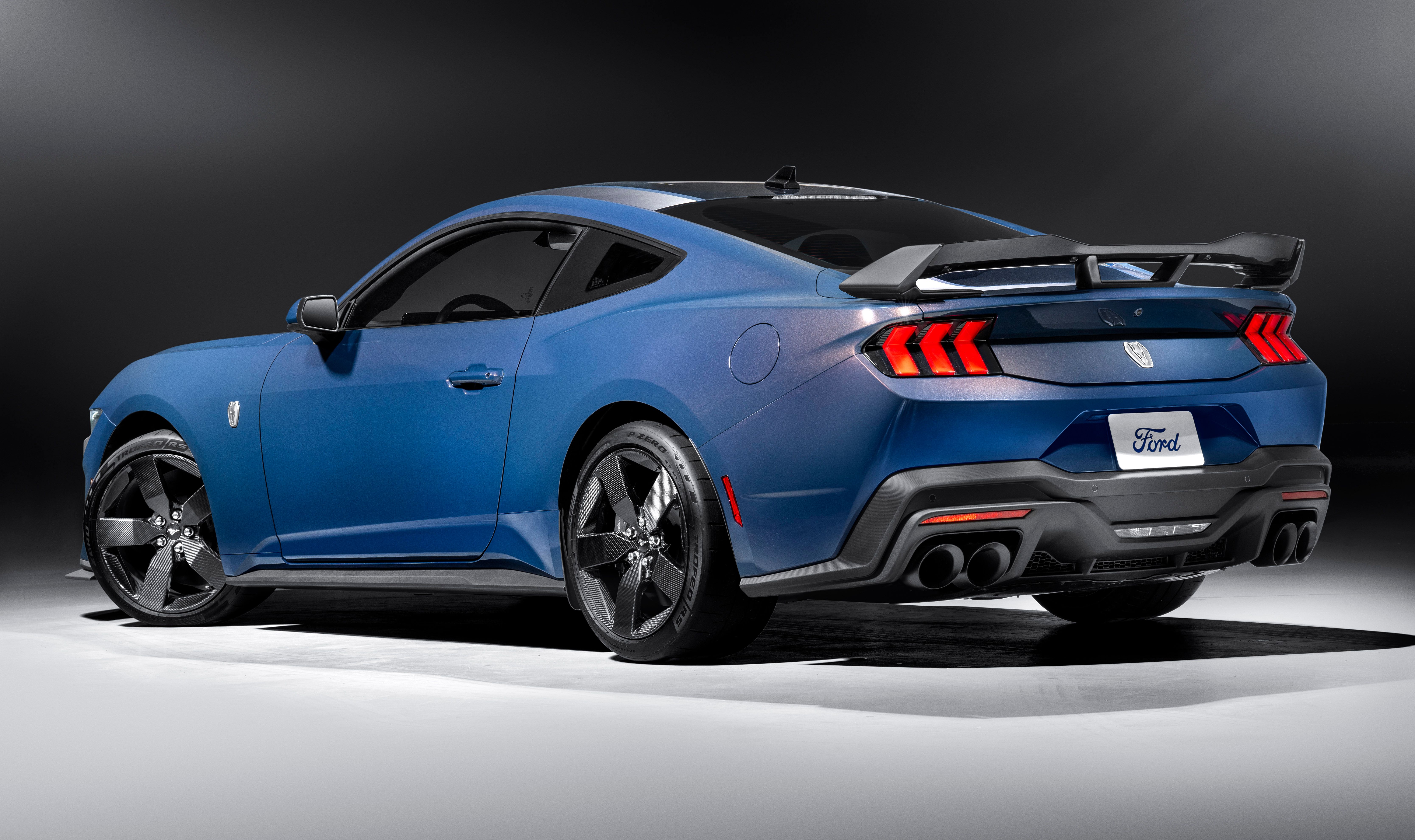 Back and side view of a blue Mustang Dark Horse with Carbon Fiber Wheels