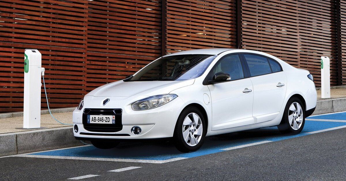 A white 2013 Renault Fluence ZE parked