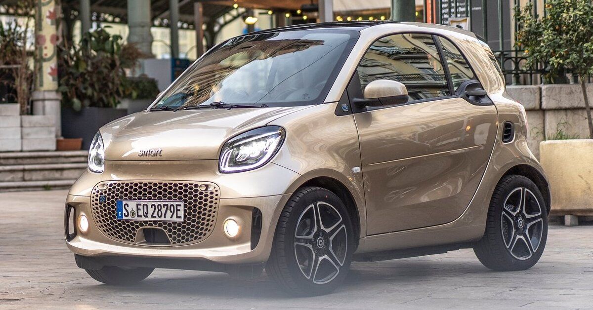 A gold 2020 Smart EQ Fortwo parked