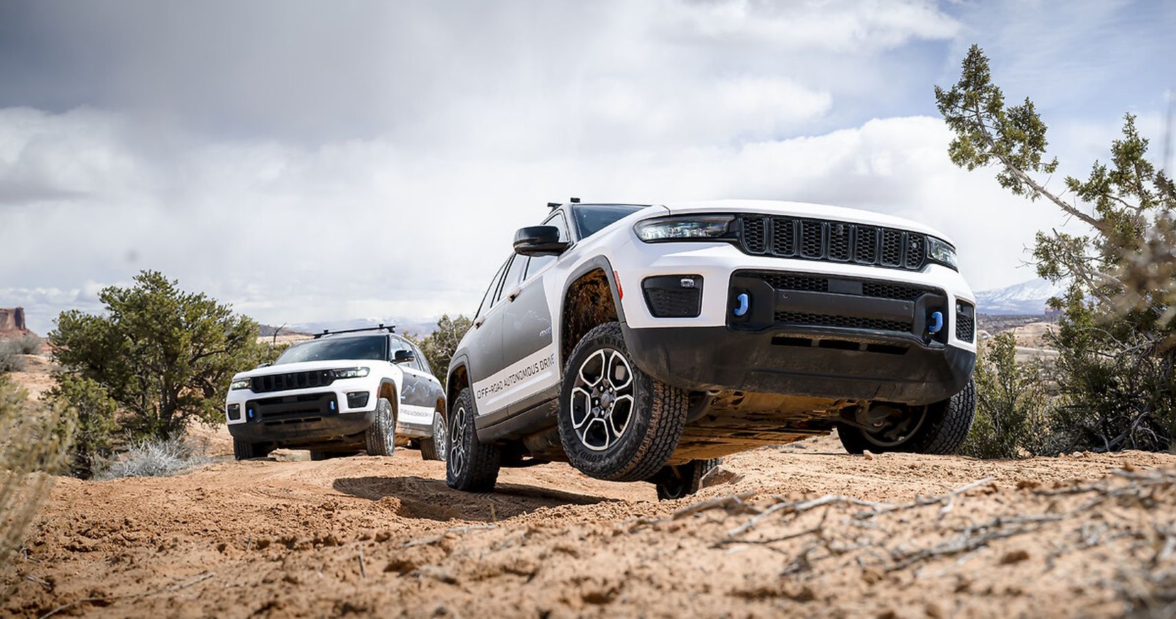 Two Jeep Grand Cherokee 4xe SUVs testing autonomous off-road driving technology in Moab, Utah