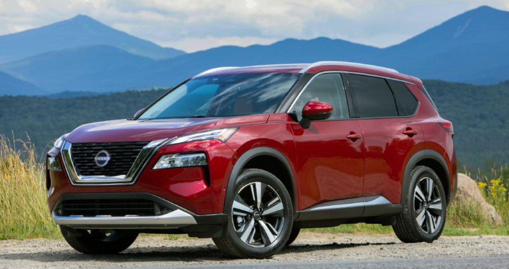 Red 2023 Nissan Rogue on the road