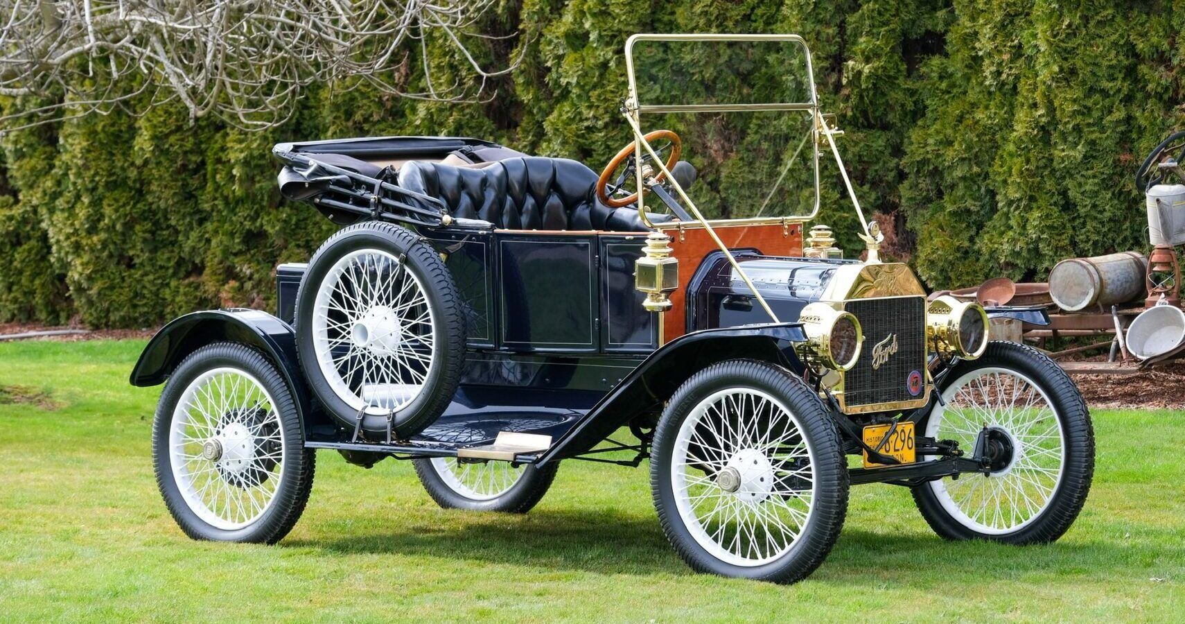 A black 1912 Ford Model T Torpedo Roadster parked