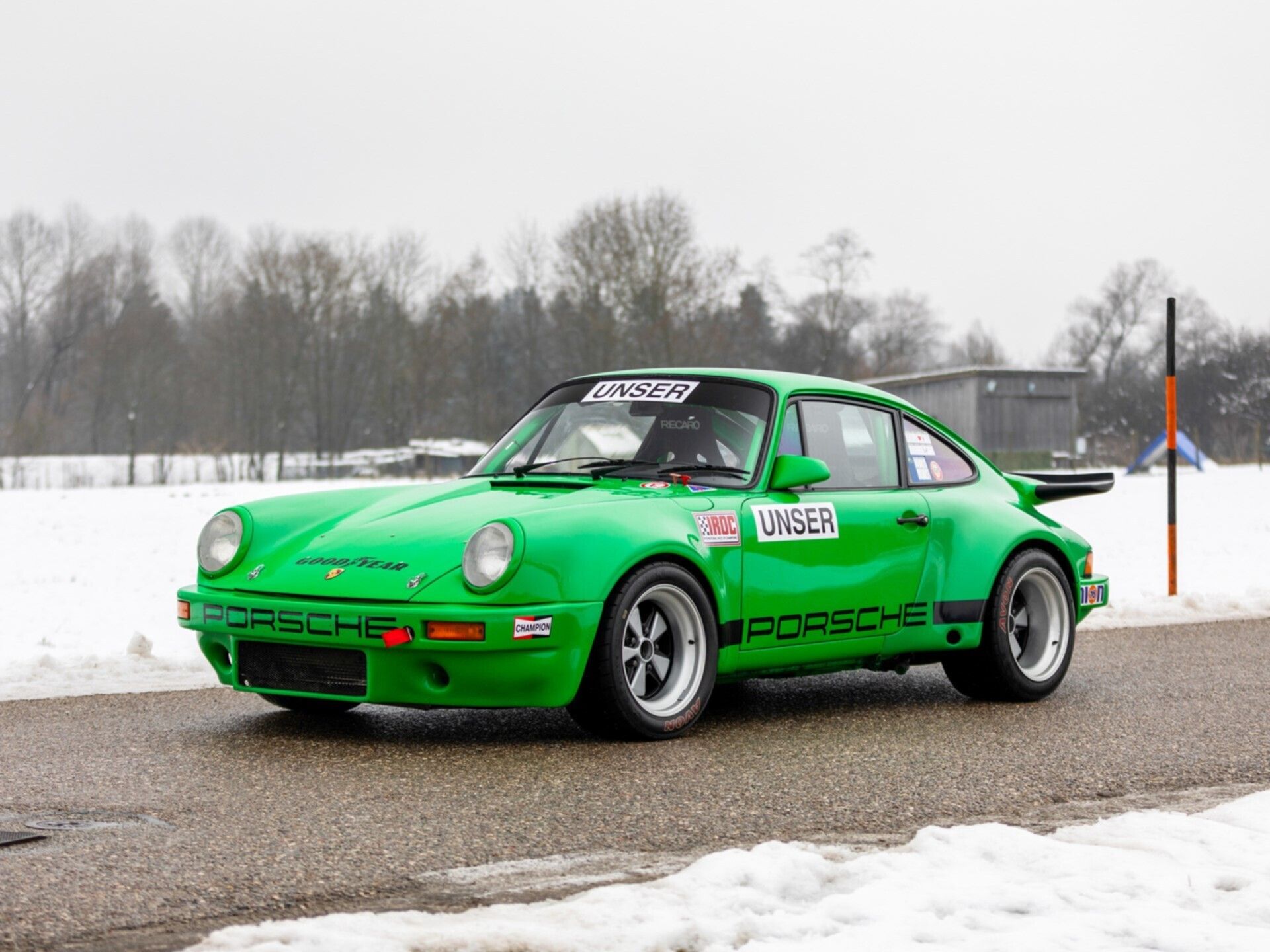 1975 Porsche 911 Carerra green parked in snow