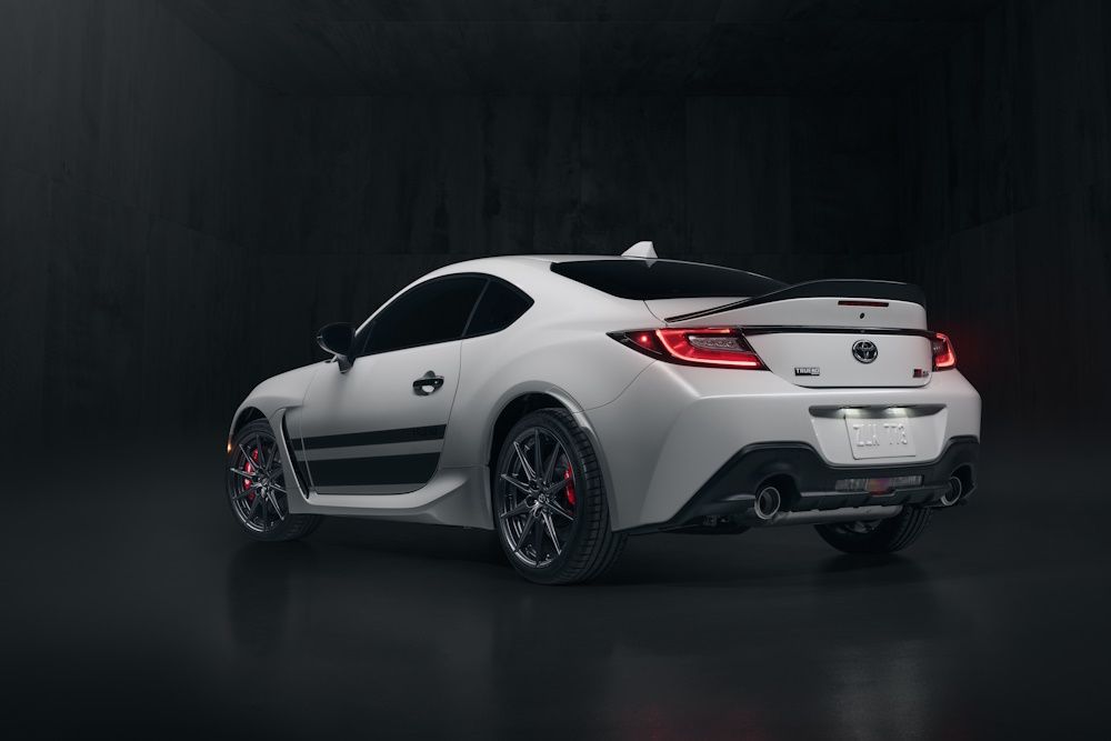 Rear-side view of a 2024 Toyota GR86 Trueno Edition in Halo white