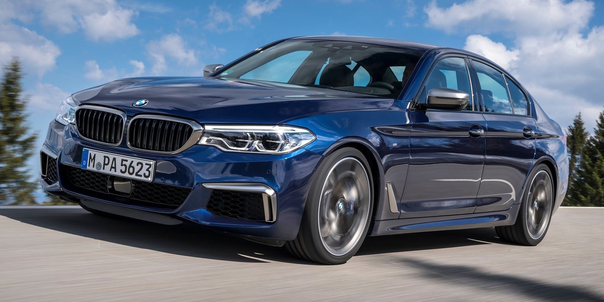 BMW M550i Front Quarter Bluestone Metallic Driving