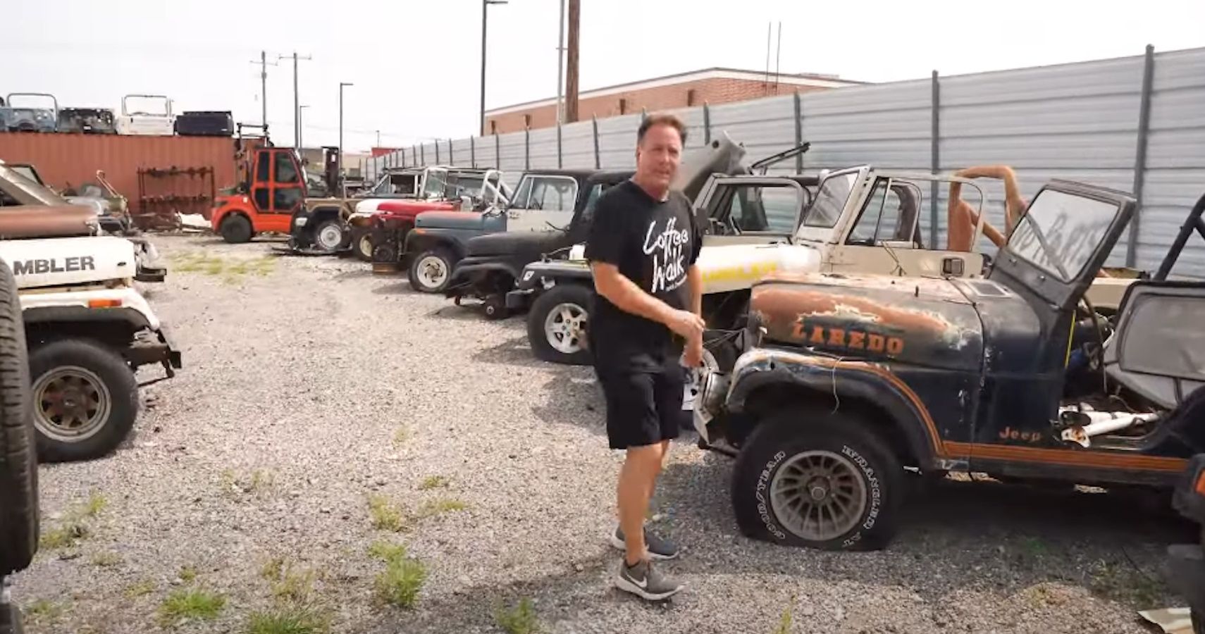 Dennis Collins amid Jeep CJ-5s, CJ-7s, and Scramblers
