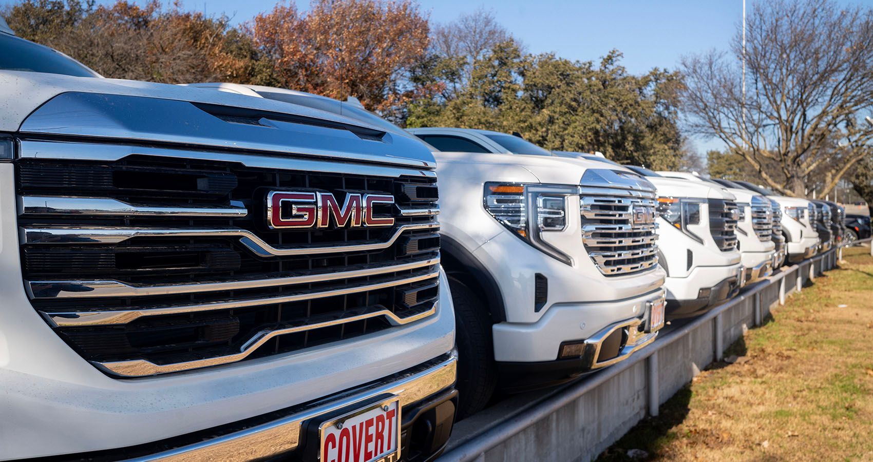 GMC trucks Parked At Dealership
