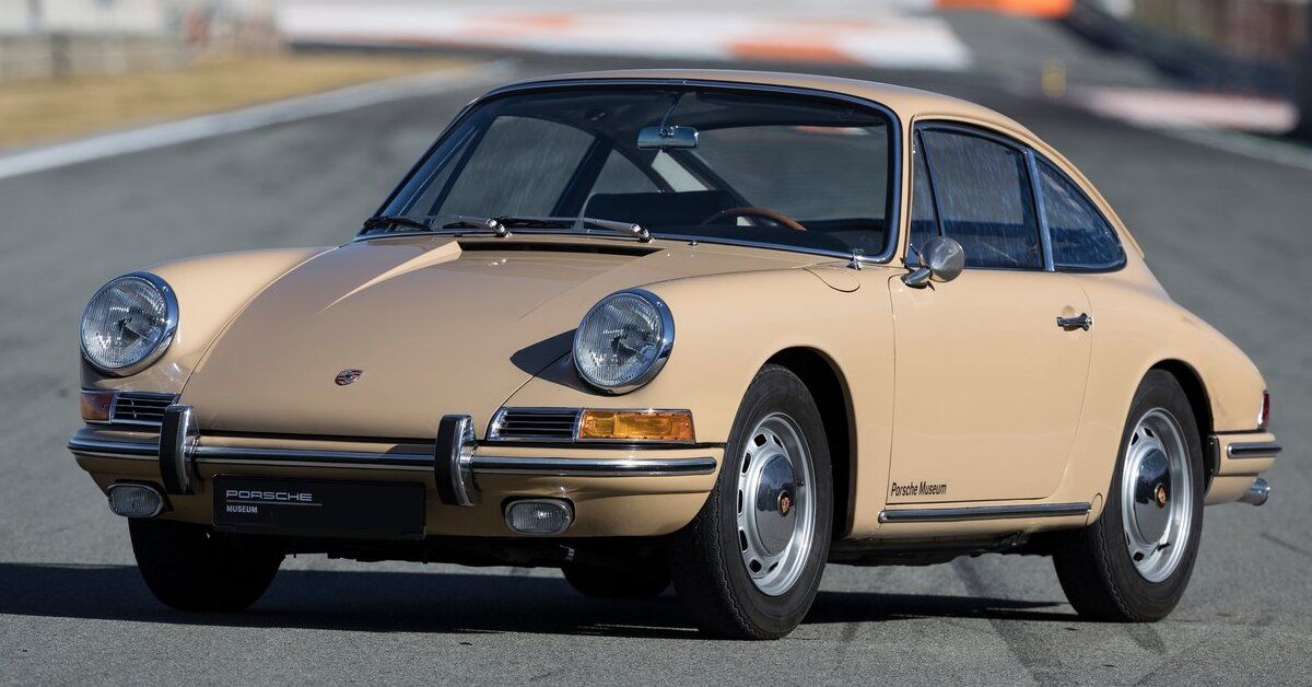 A tan 1964 Porsche 911 2.0 Coupe parked