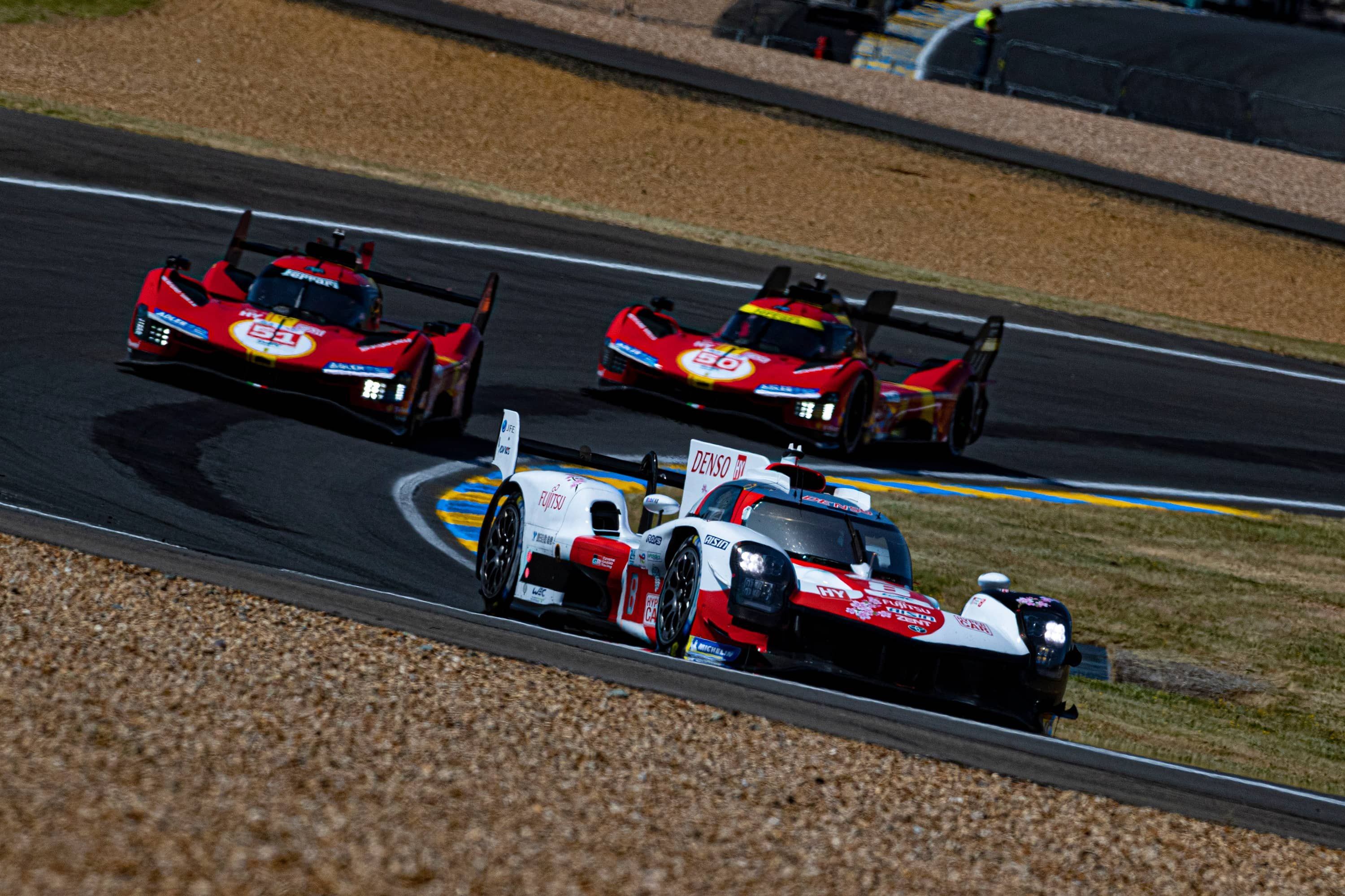 One toyota and two Ferraris at Le Mans