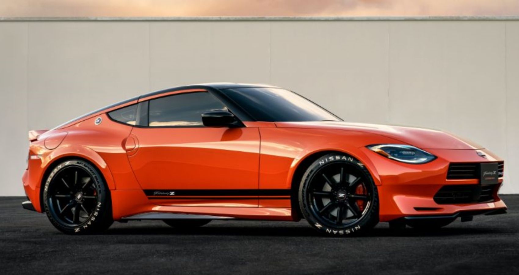 The 2023 Nissan Z Modified By Nissan With Retro Orange And Datsun 240Z Grille