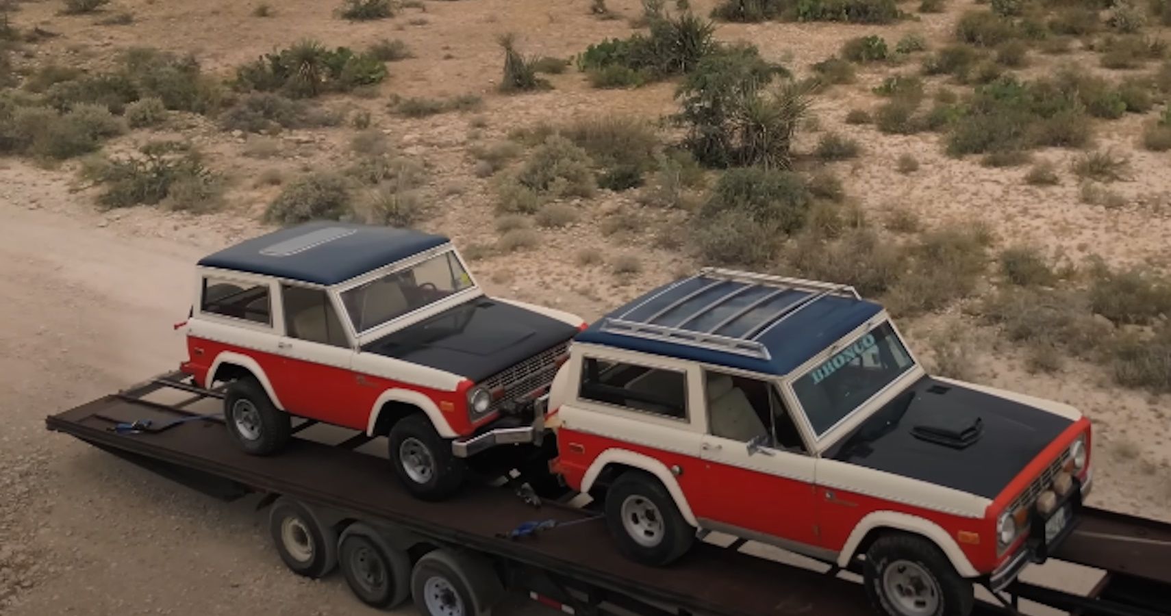 A pair of Stroppe Ford Broncos on a trailer