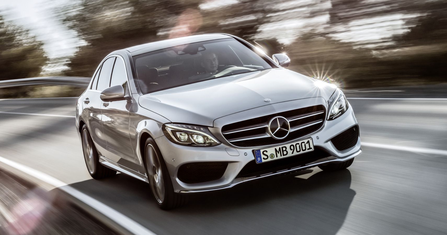 Silver 2015 Mercedes-Benz C-Class driven on the track
