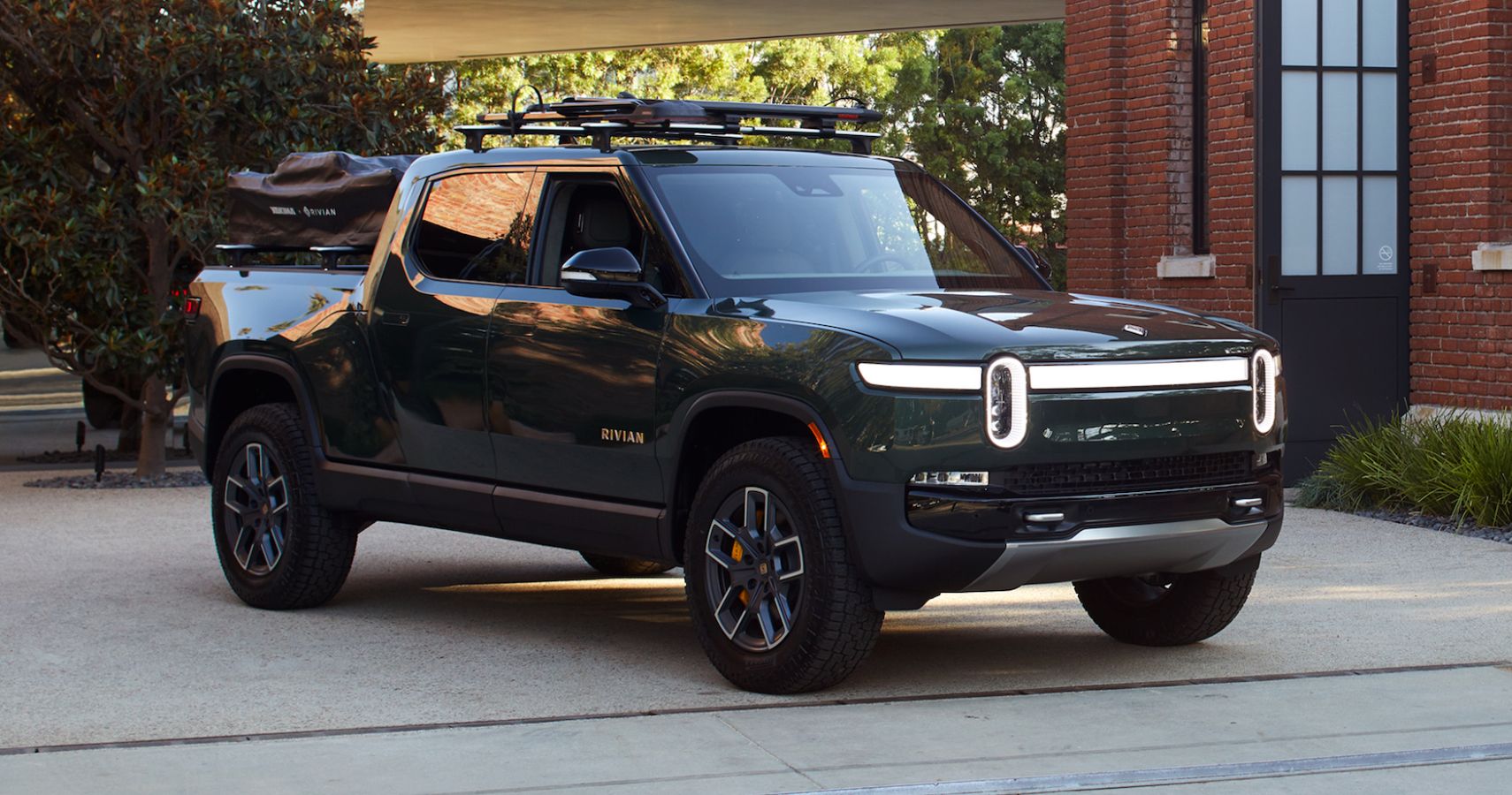 Green 2022 Rivian R1T parked outdoors