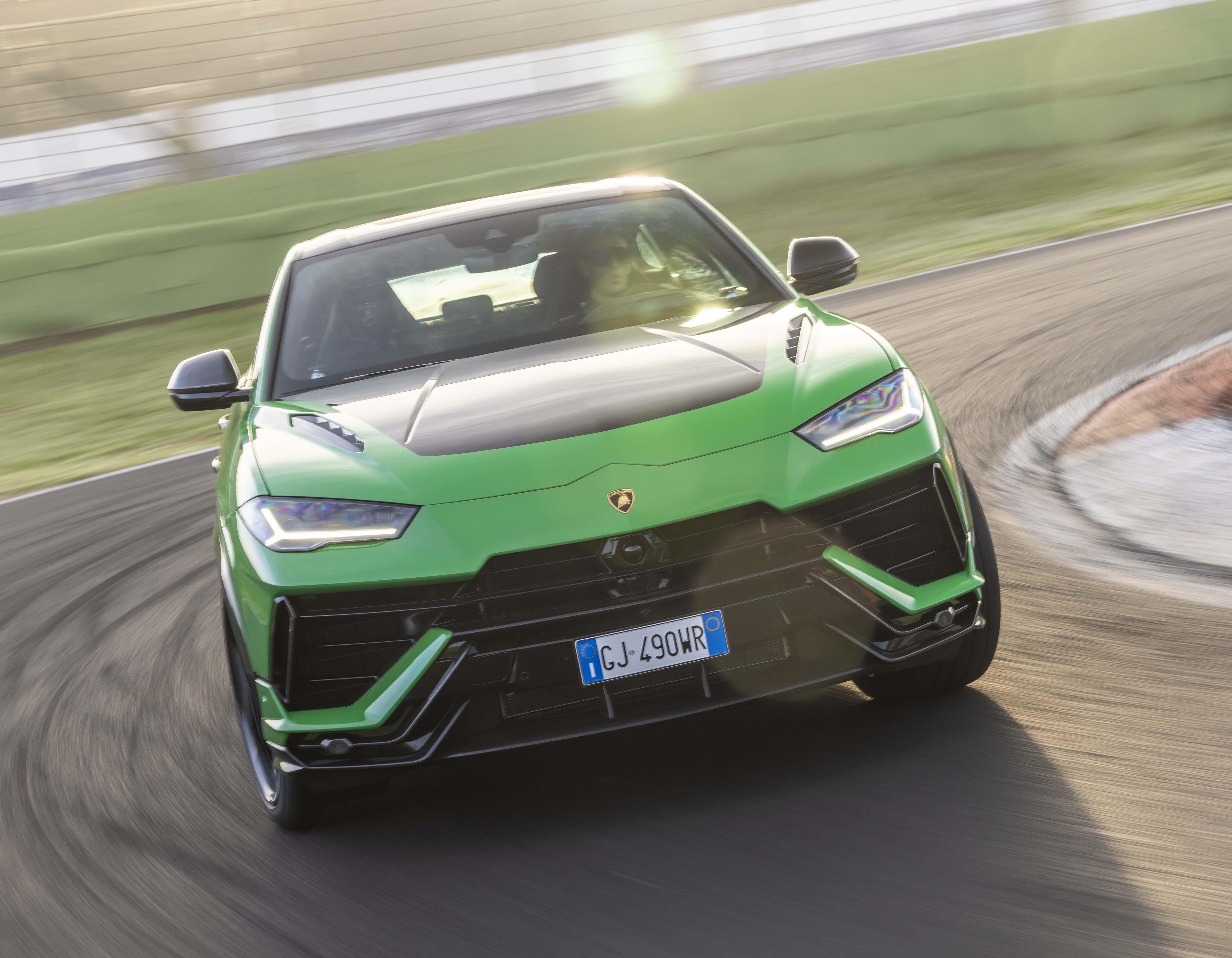 Green Lamborghini Urus Performante driven on the track