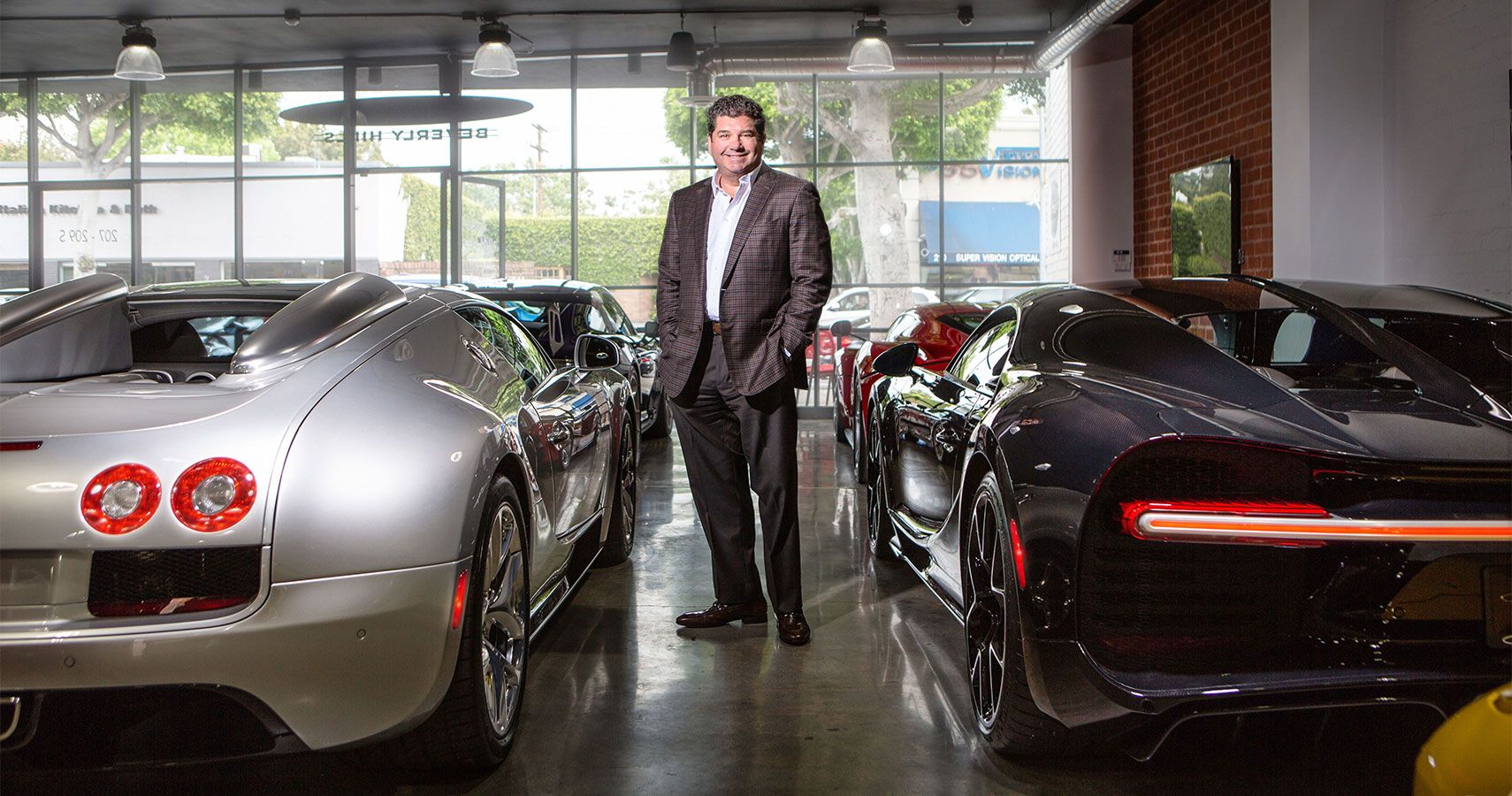 Steven Posner of Putnam Leasing with a car collection