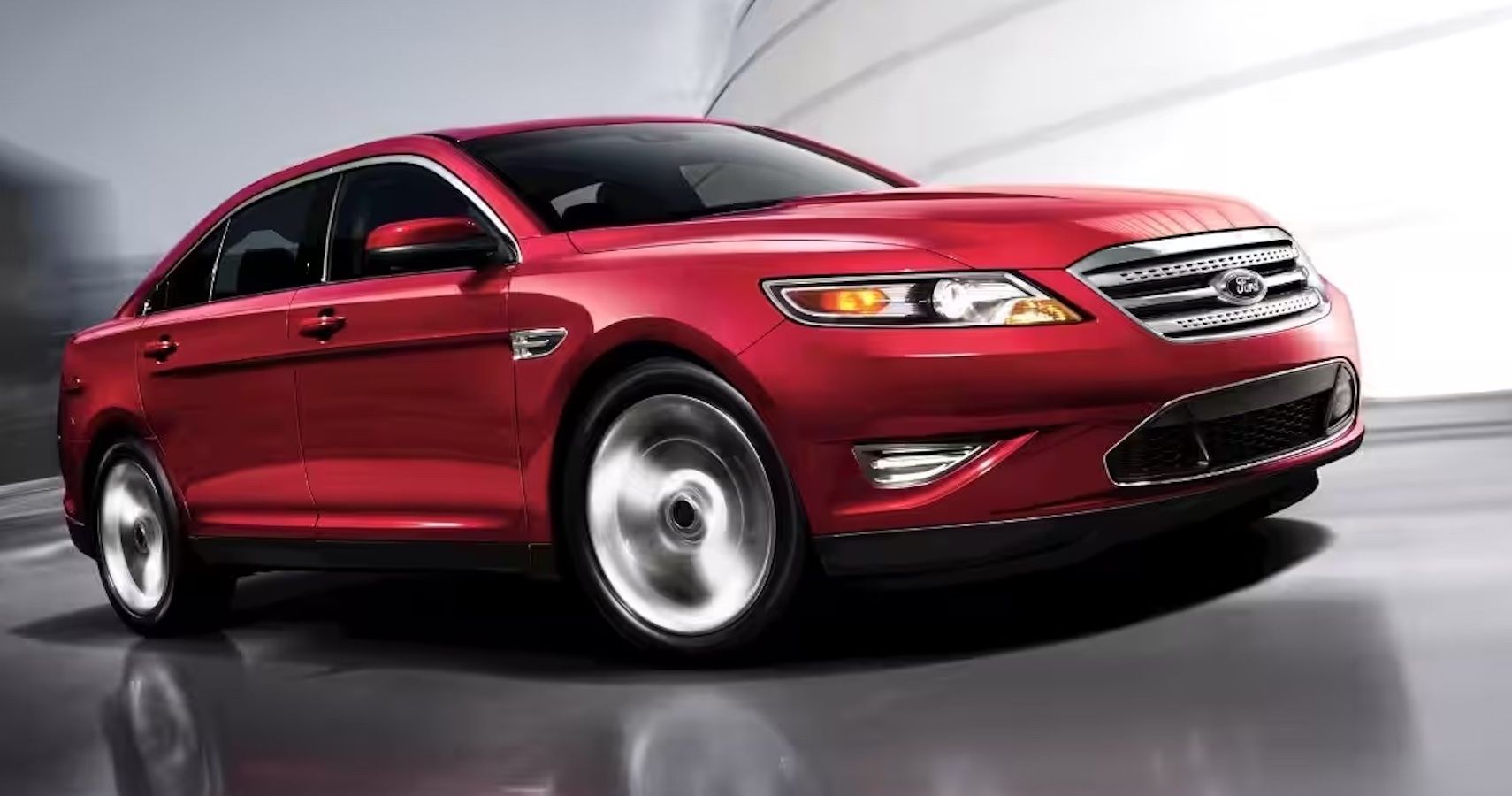 Red 2011 Ford Taurus SHO on the road
