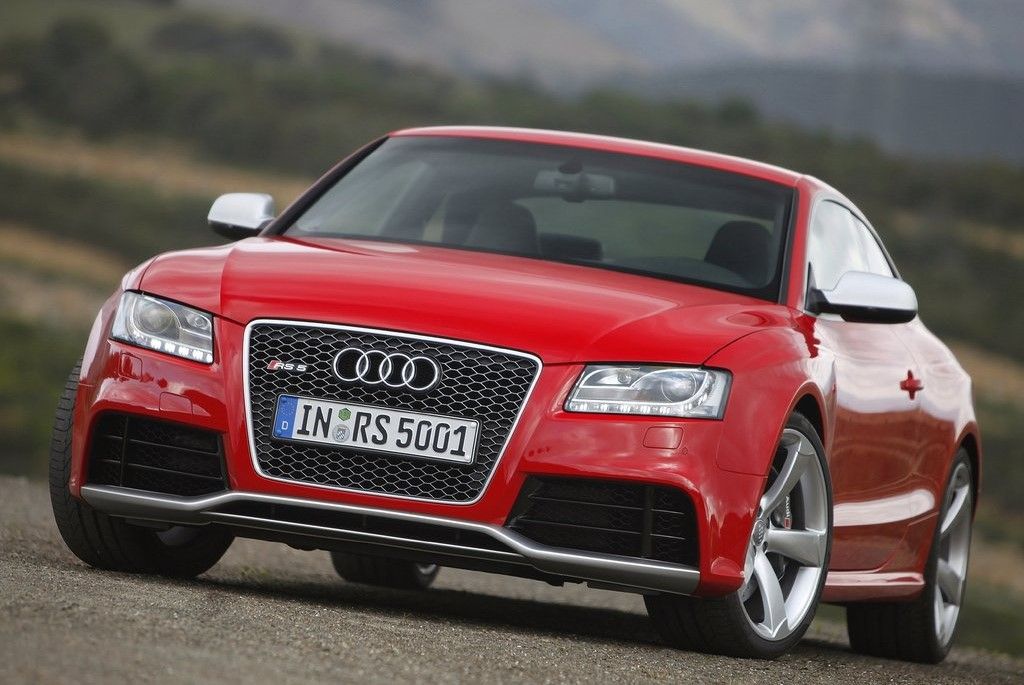 Red 2013 Audi RS5 on the road