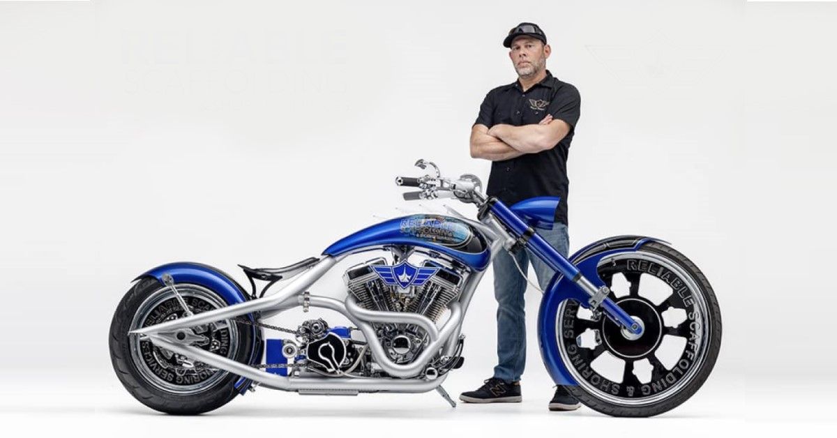 Paul Teutul Jr posing with his latest custom chopper from 2023 for Reliable Scaffolding & Shoring Services