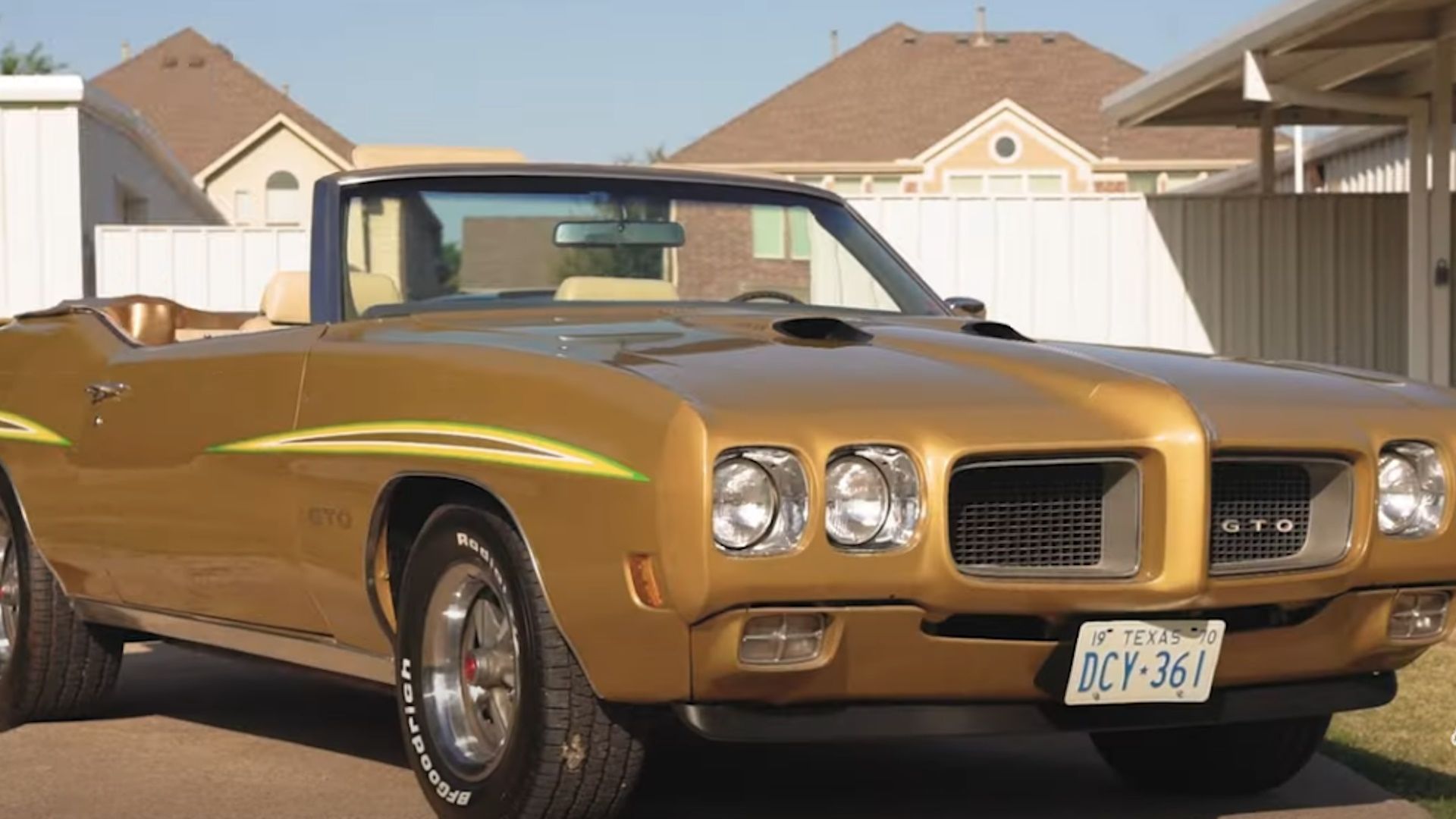 A gold 1970 Pontiac GTO convertible with the top down