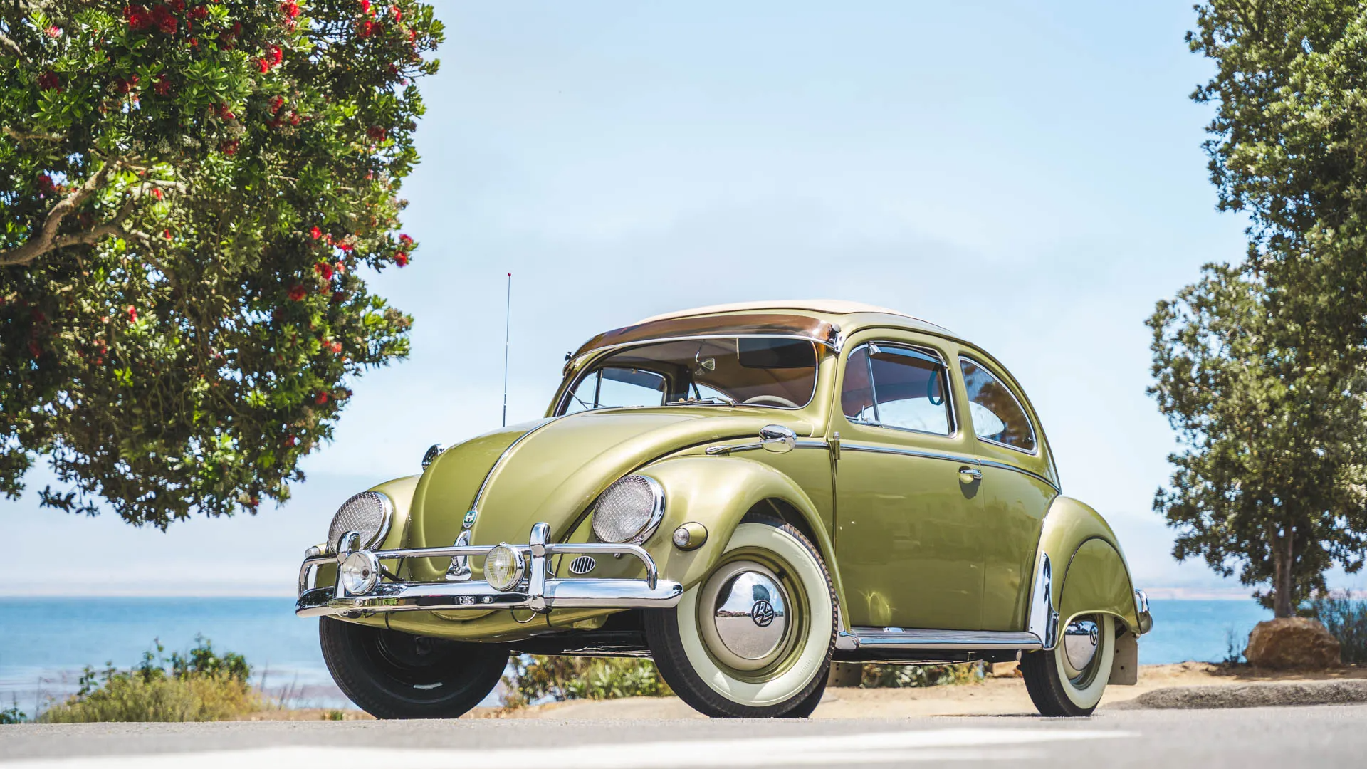 1956 Volkswagen Beetle green sedan parked